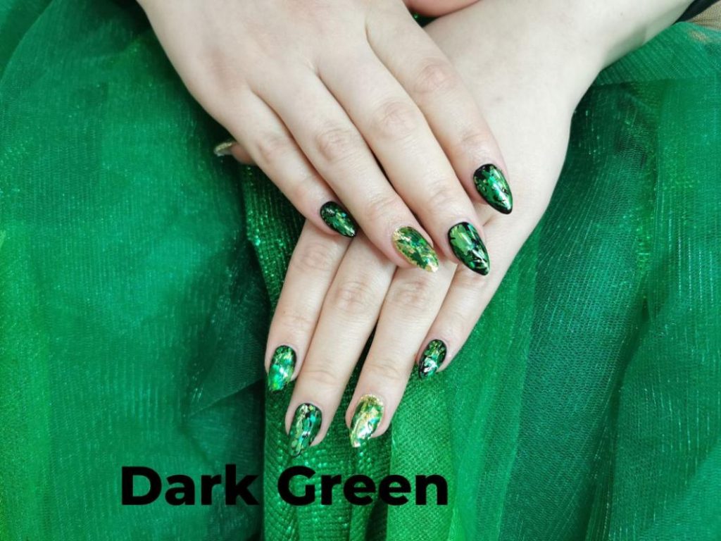 Showcasing dark green nail trends for 2024: glossy finishes, matte textures, and artistic designs for a chic look