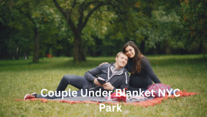 Exploring the charm of a Couple Under a Blanket in NYC Park, surrounded by nature and urban scenery